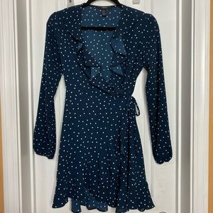 Navy/white polka dot wrap dress with ruffle detail
